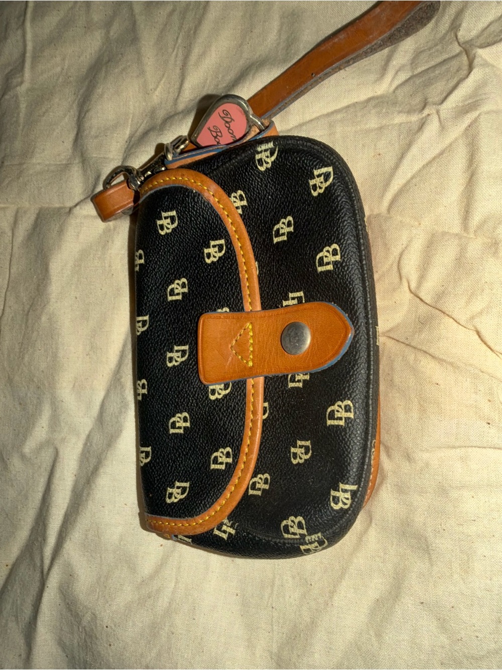 Dooney & Bourke Black and Tan Signature Wristlet